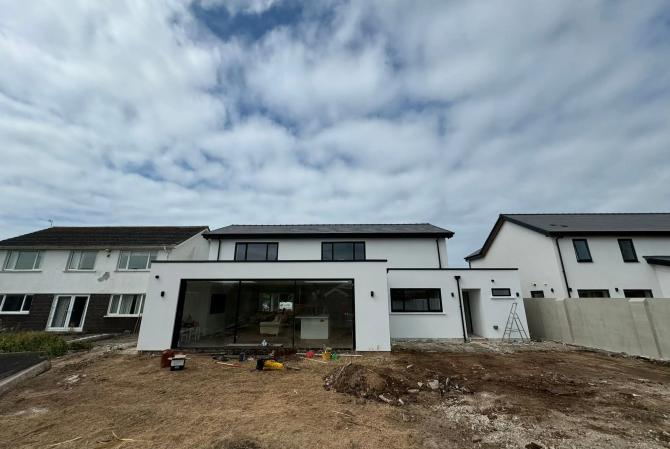 Exterior pointing to a stunning property in Rest bay Porthcawl